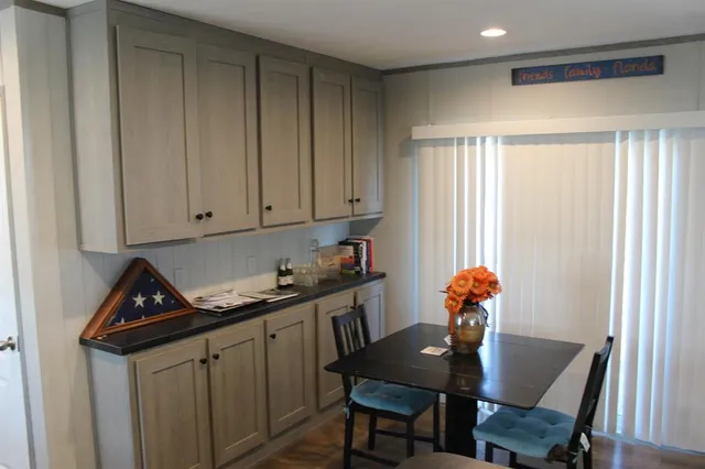 a view of a room with furniture and wooden floor