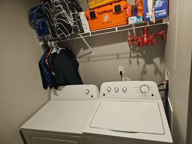 a utility room with dryer and washer
