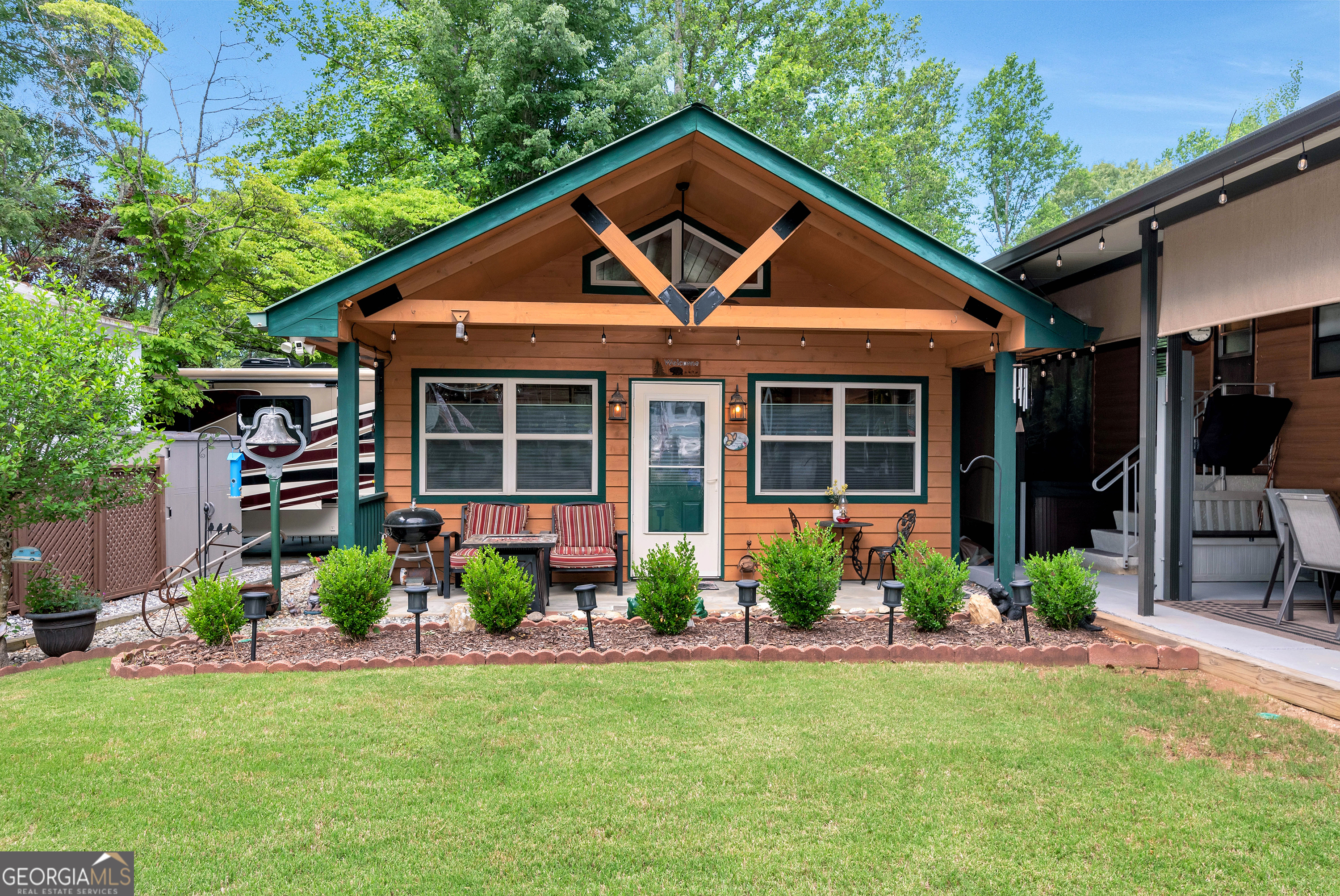 a front view of a house with a yard and porch