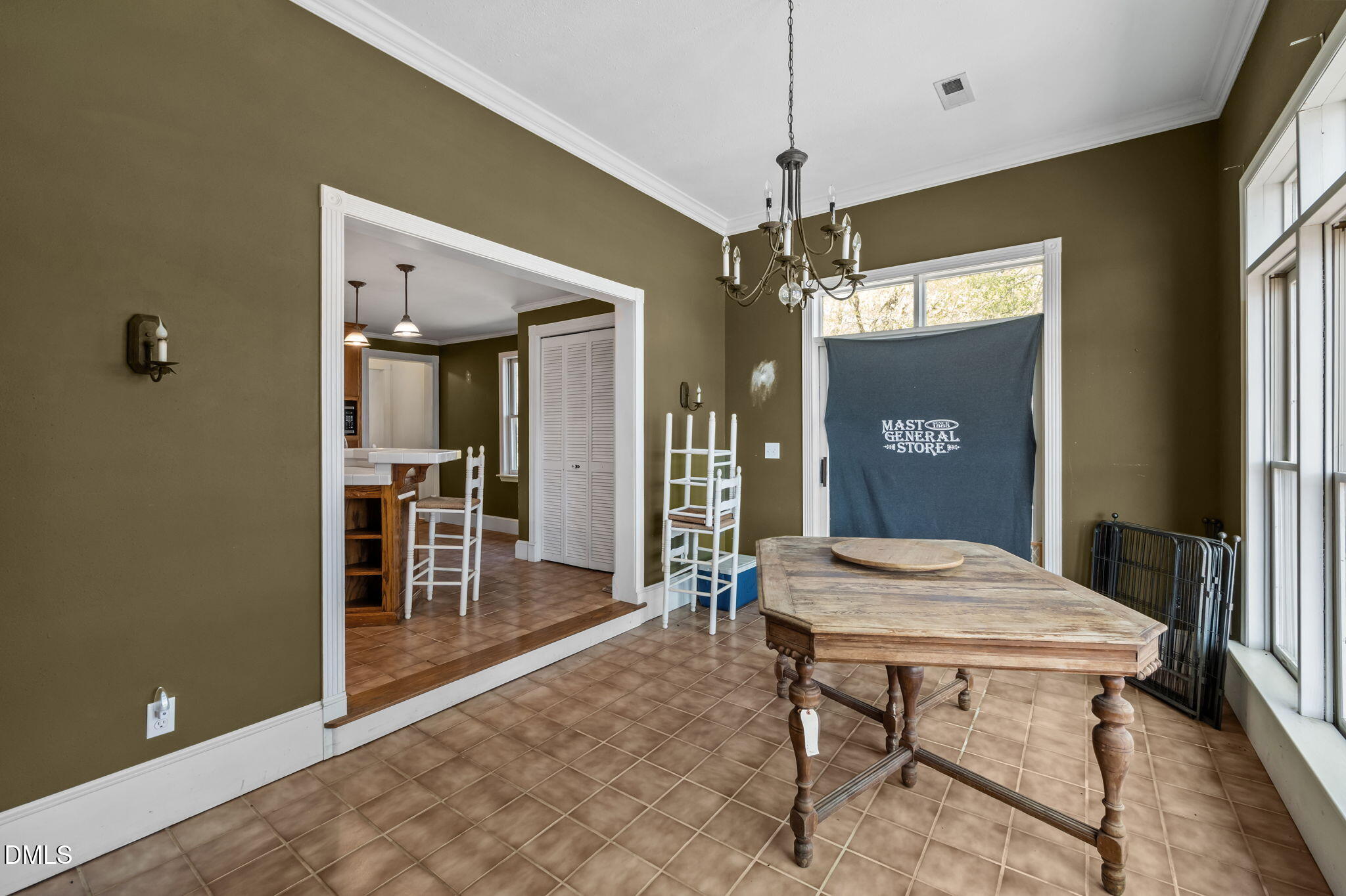 212 Thomas Humphries Road Roxboro, NC 27574 - Photo 32 of 56 a view of a a dining room with furniture window and wooden floor