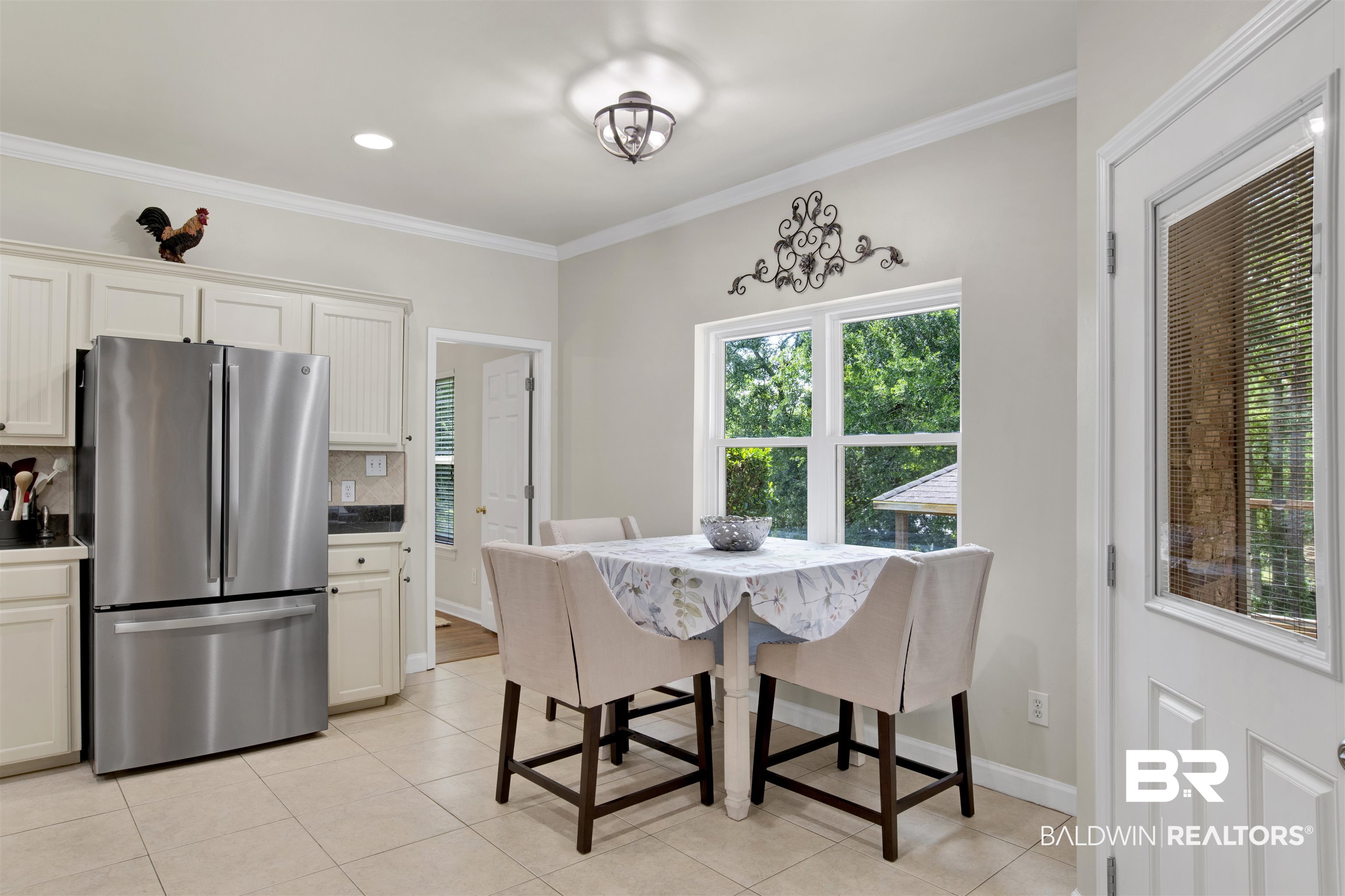 638 Southern Way Daphne, AL 36527 - Photo 6 of 26 Dining room with light tile patterned flooring and ornamental molding