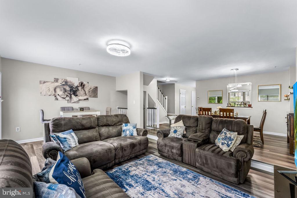 11409 Hermosa Drive Laurel, MD 20708 - Photo 6 of 28 a living room with furniture and a couch