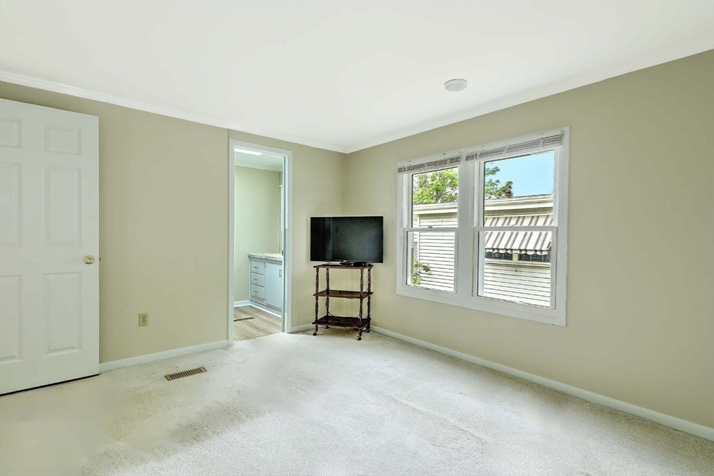 7 Queens Road Attleboro, MA 02703 - Photo 15 of 33 a living room with furniture and a flat screen tv