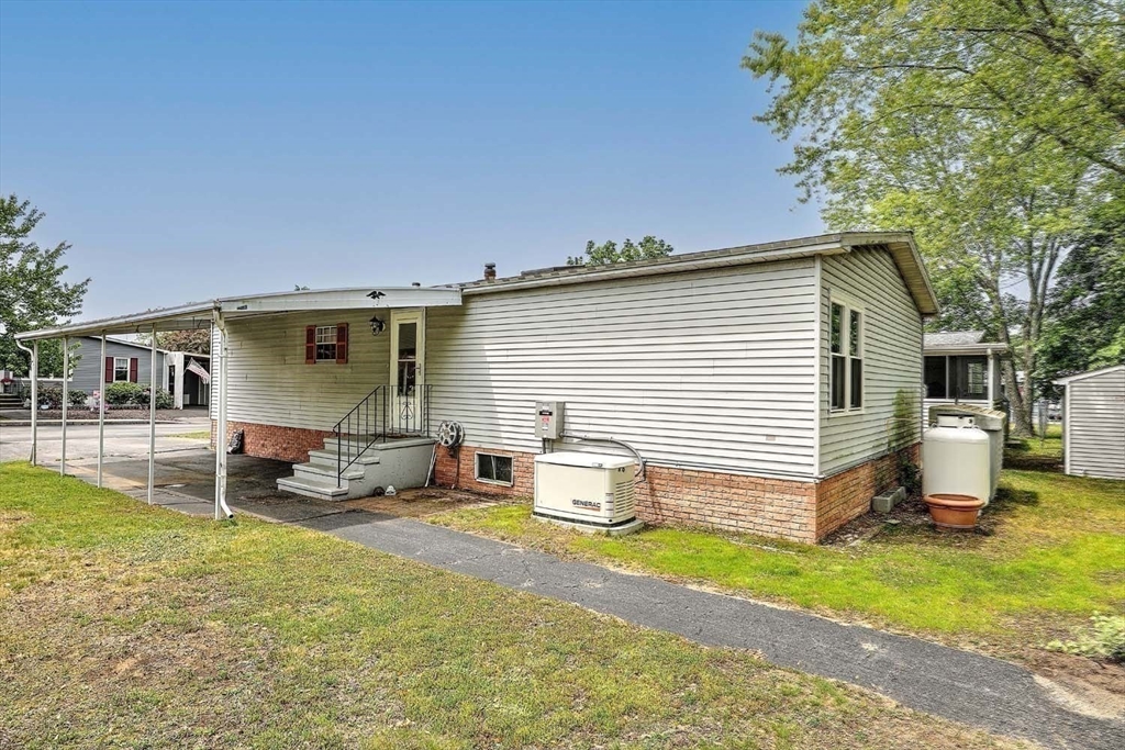 7 Queens Road Attleboro, MA 02703 - Photo 19 of 33 a view of a house with backyard and sitting area