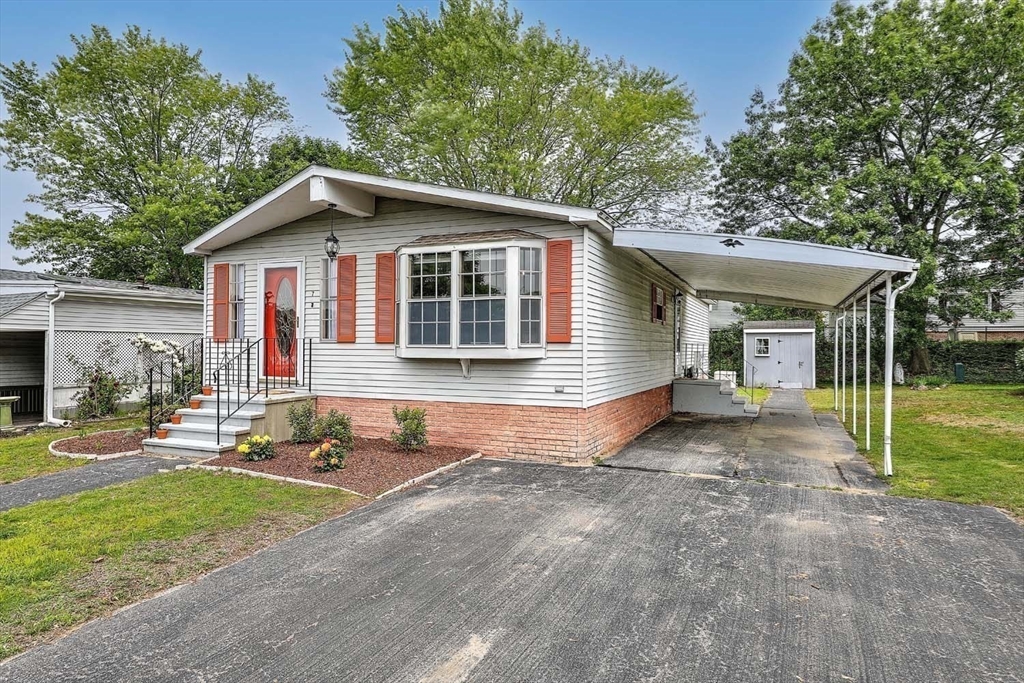 7 Queens Road Attleboro, MA 02703 - Photo 2 of 33 a view of a house with a yard and large tree