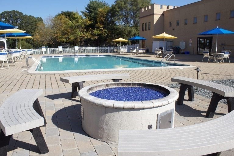 7 Queens Road Attleboro, MA 02703 - Photo 30 of 33 a view of a chairs and table in the patio