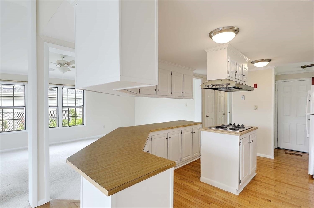 7 Queens Road Attleboro, MA 02703 - Photo 8 of 33 a kitchen with stainless steel appliances granite countertop a sink a stove and a refrigerator