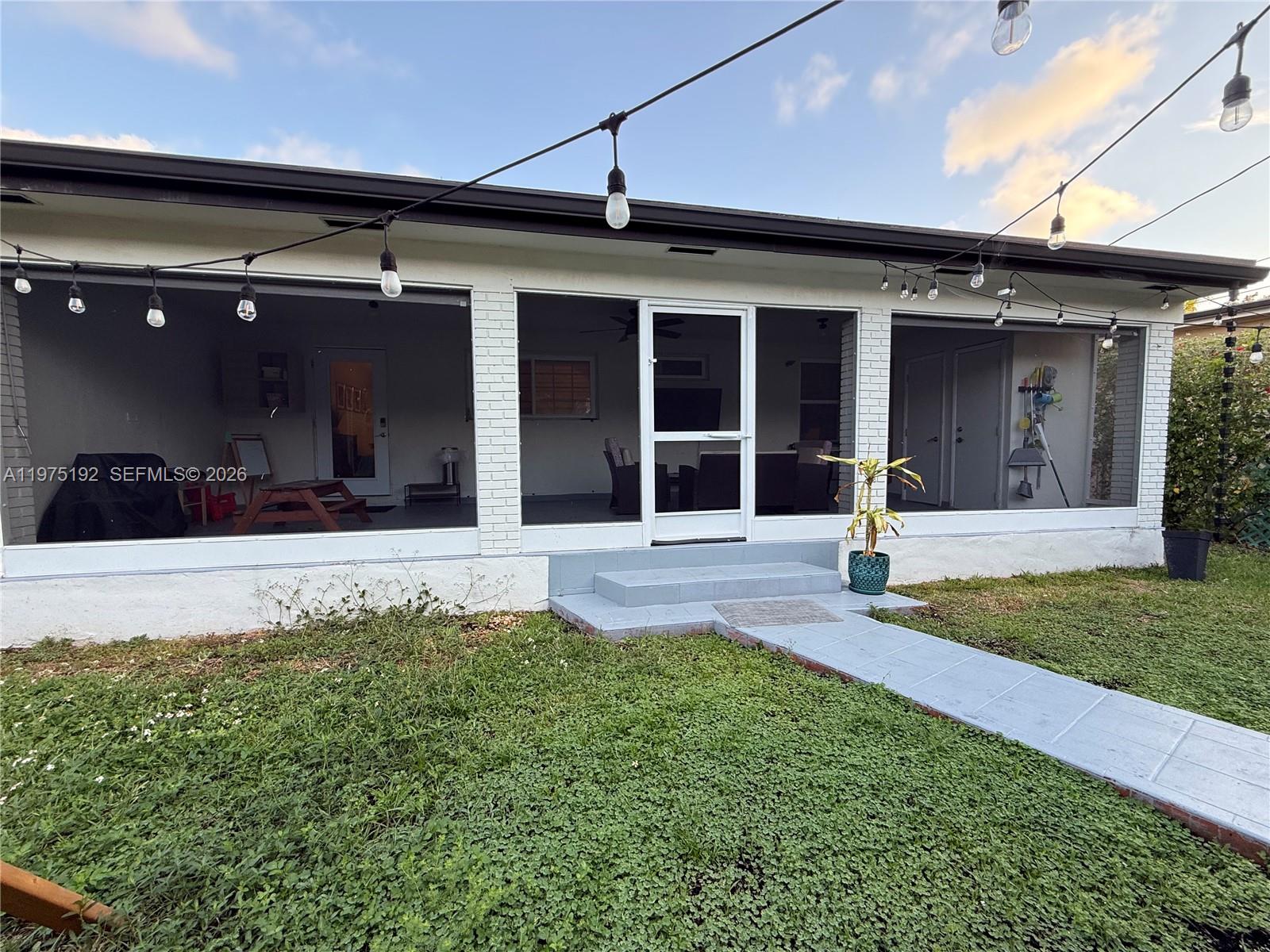 4850 Southwest 4th Street Miami, FL 33134 - Photo 20 of 28 a front view of a house with a yard