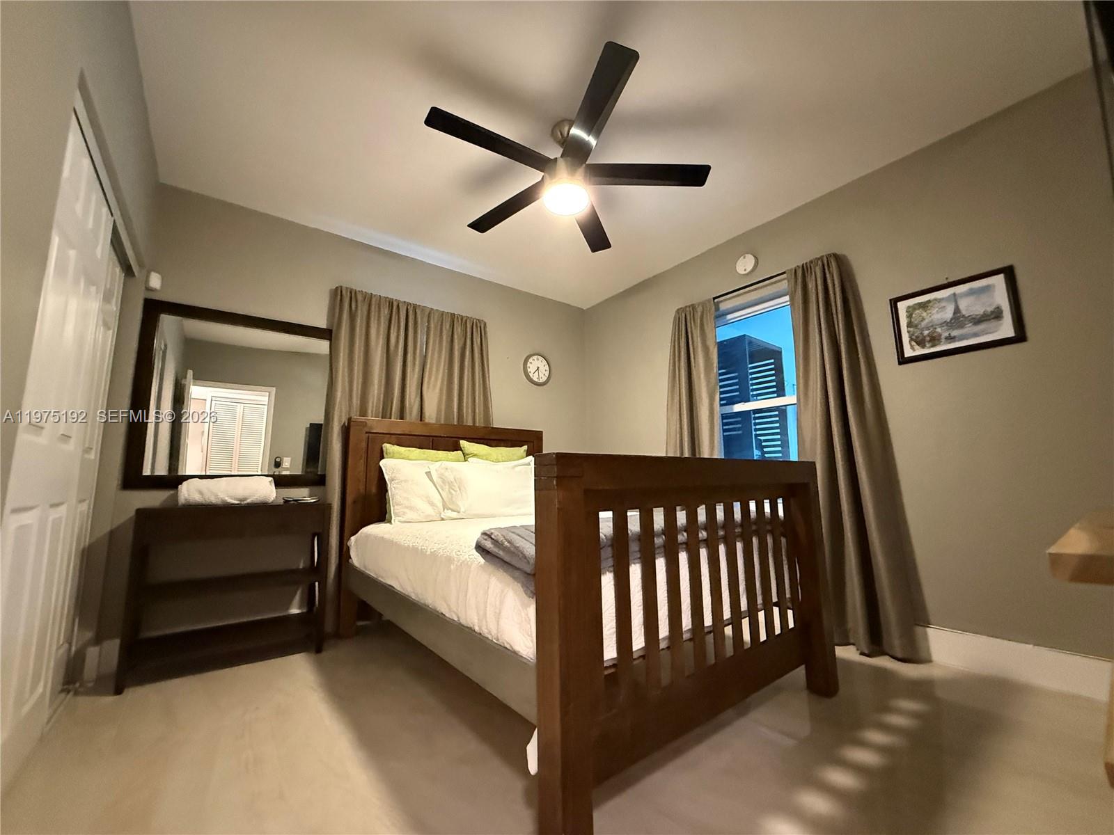 4850 Southwest 4th Street Miami, FL 33134 - Photo 24 of 28 a bedroom with a bed and window