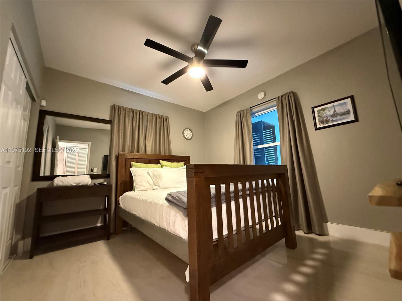 4850 Southwest 4th Street Miami, FL 33134 - Photo 25 of 28 a bedroom with a bed and window