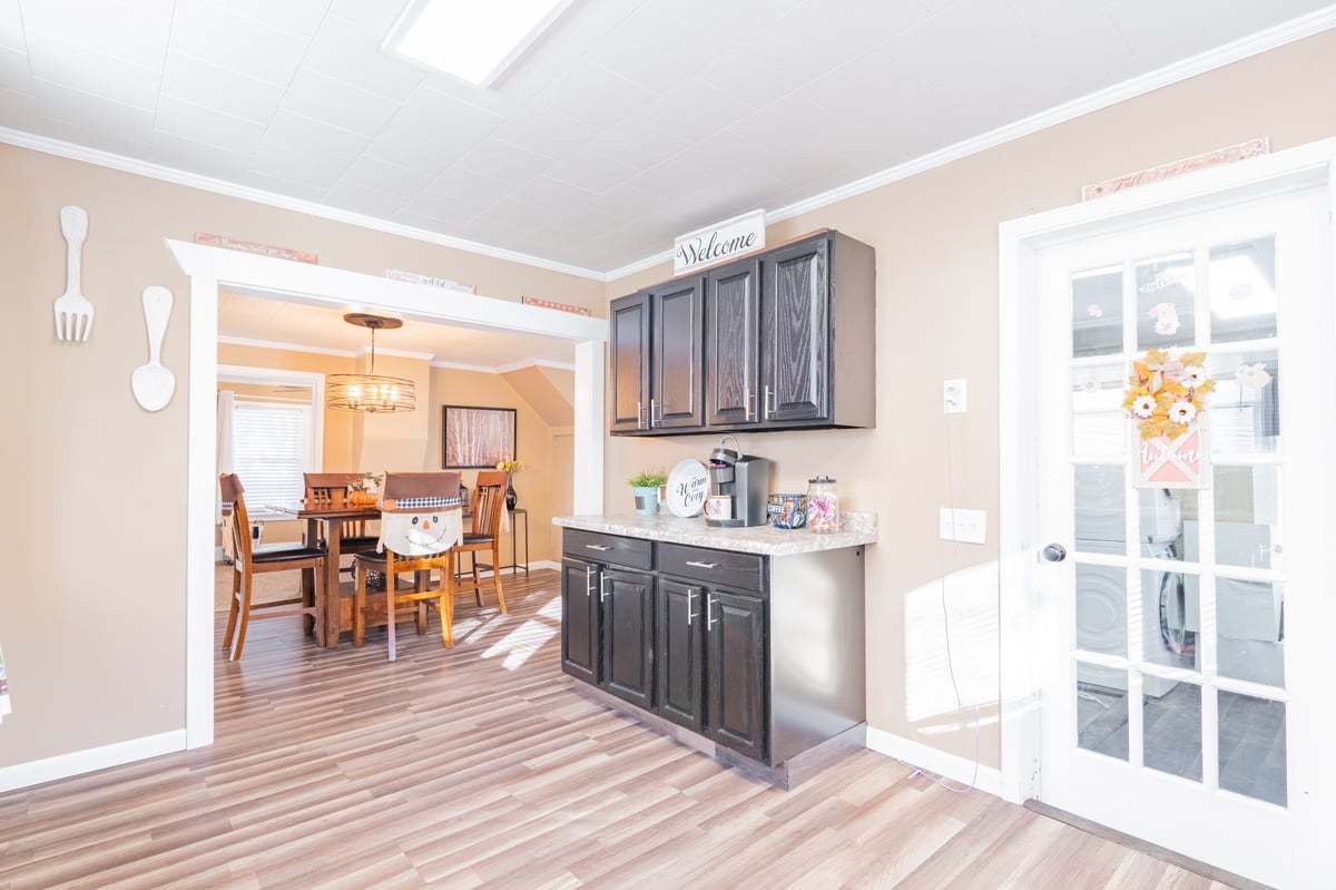 1206 East Main Street Clinton, IL 61727 - Photo 11 of 28 a kitchen with stainless steel appliances granite countertop a refrigerator and wooden cabinets