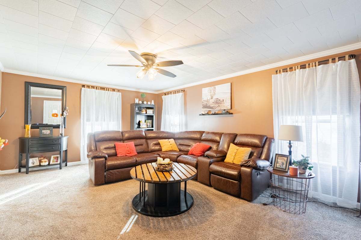 1206 East Main Street Clinton, IL 61727 - Photo 7 of 28 a living room with furniture and a large window
