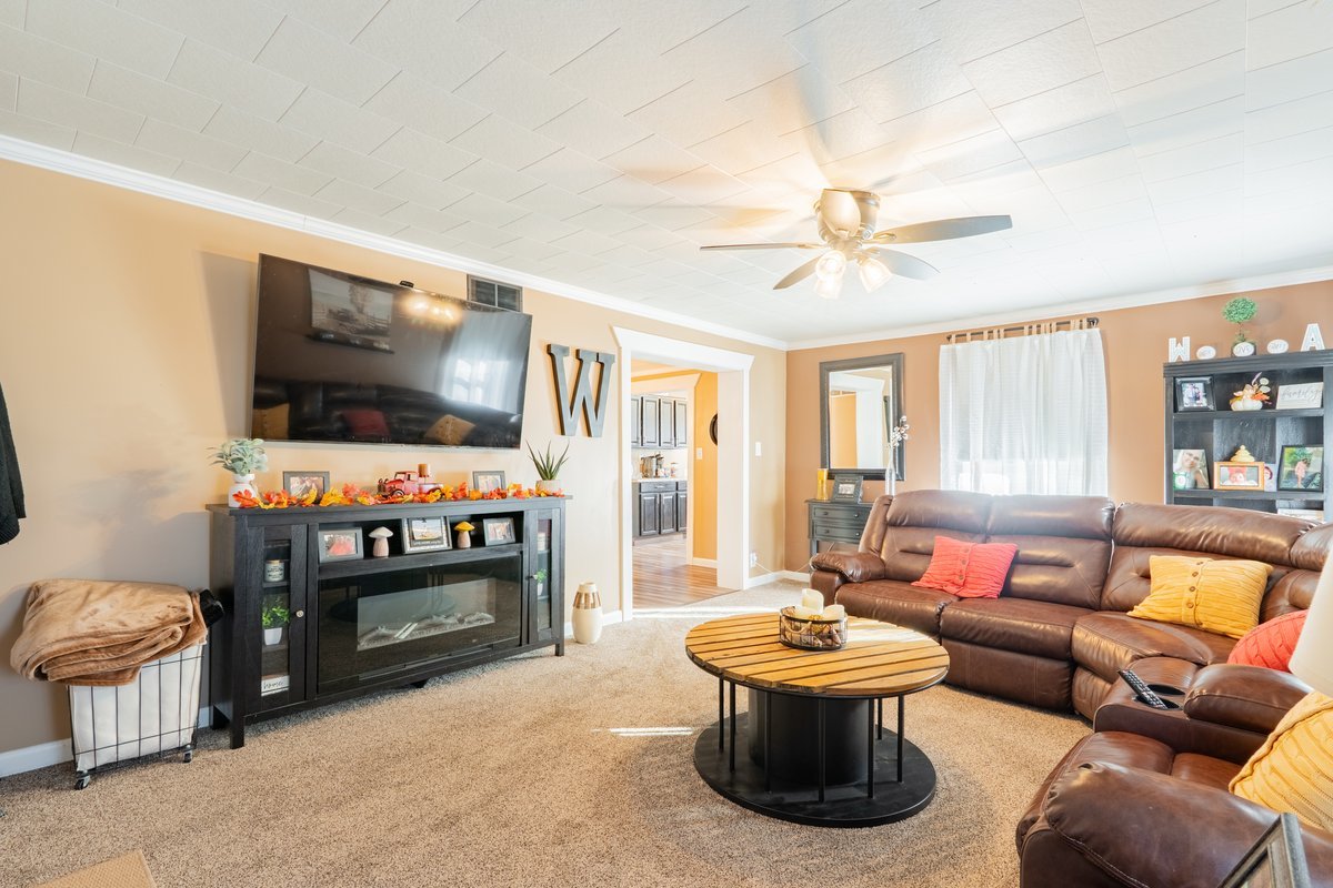 1206 East Main Street Clinton, IL 61727 - Photo 8 of 28 a living room with furniture and a flat screen tv