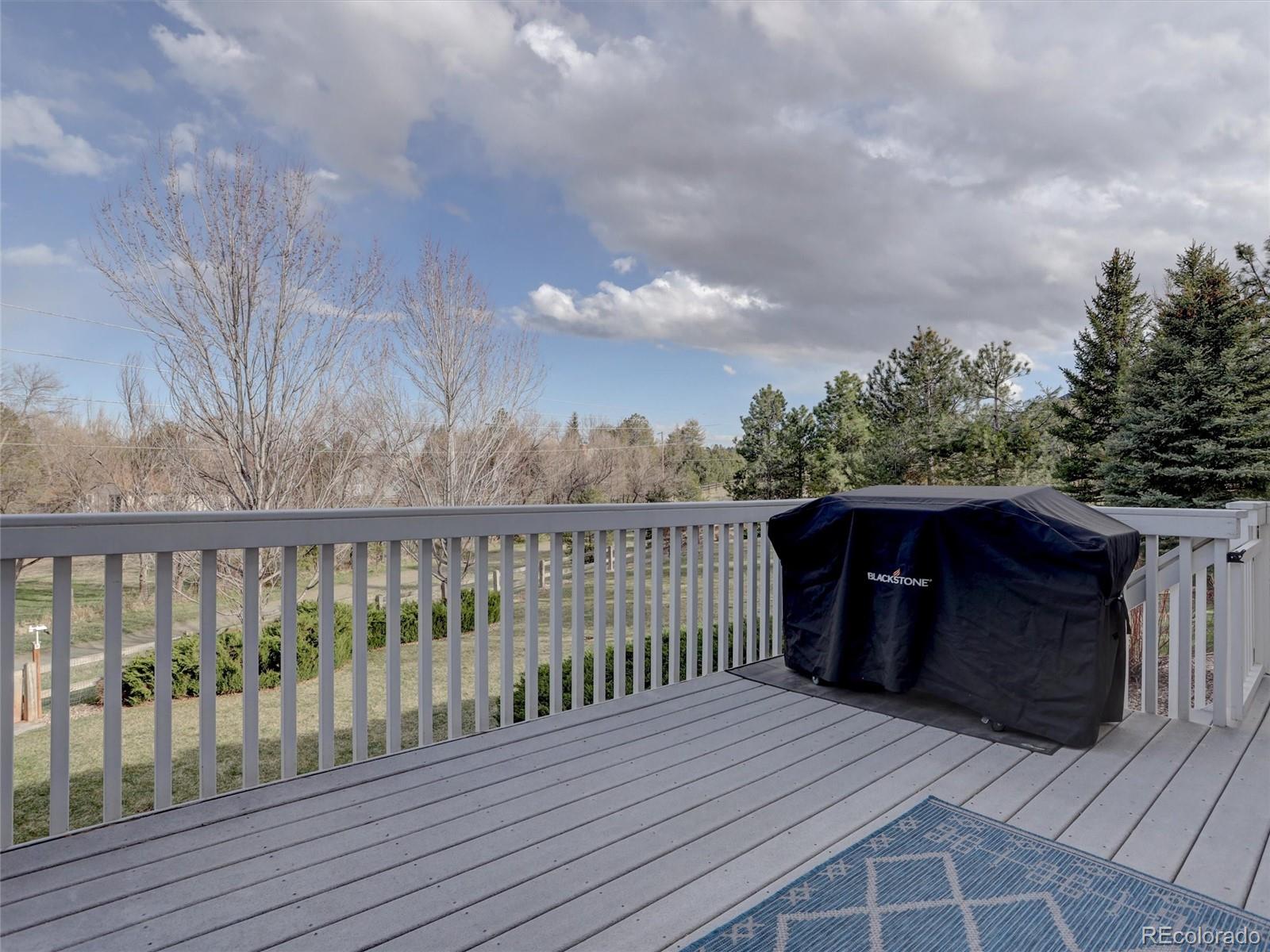18288 East Caley Place Aurora, CO 80016 - Photo 12 of 50 a balcony with wooden floor