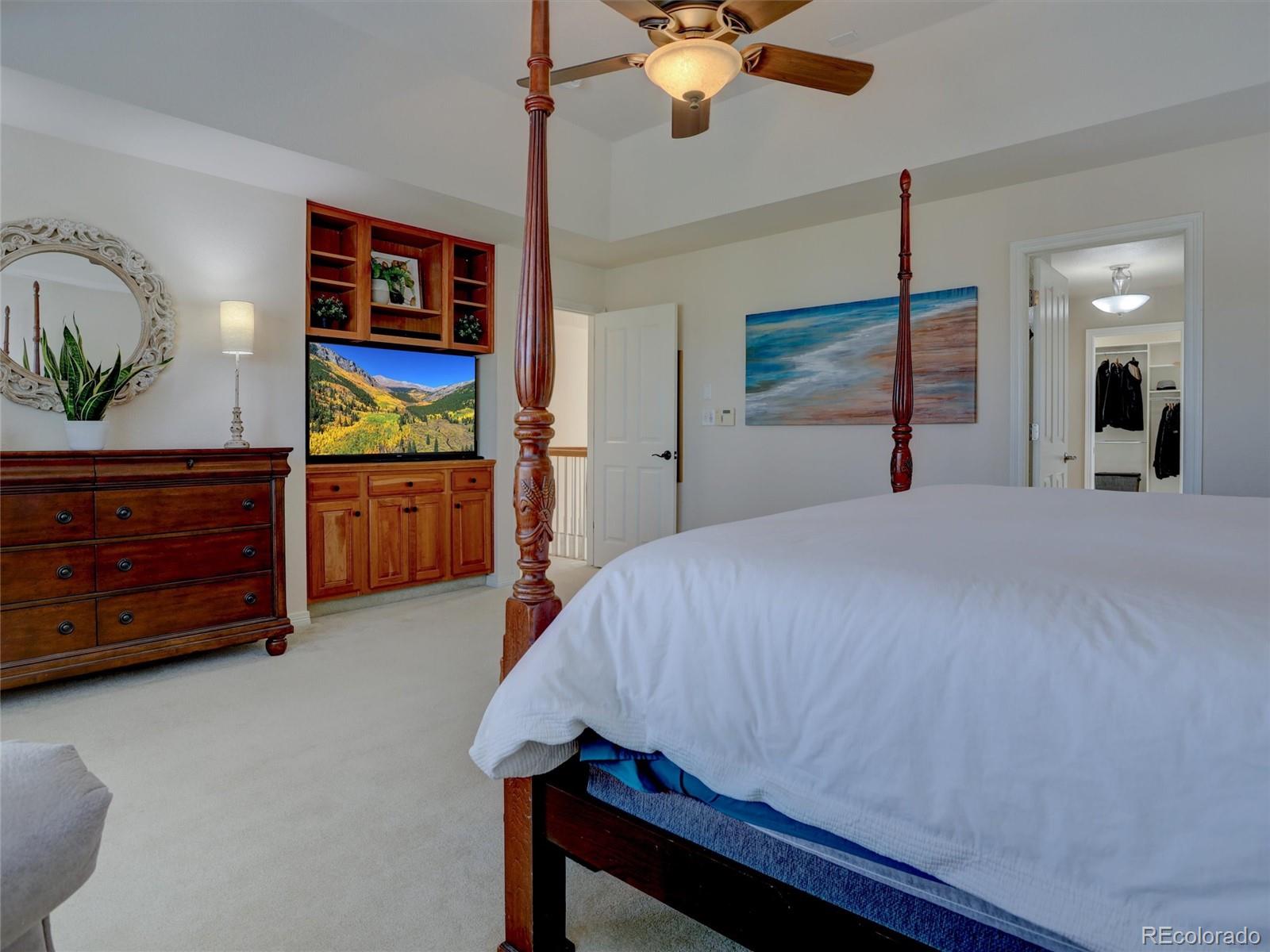 18288 East Caley Place Aurora, CO 80016 - Photo 17 of 50 a bedroom with a bed and a dresser