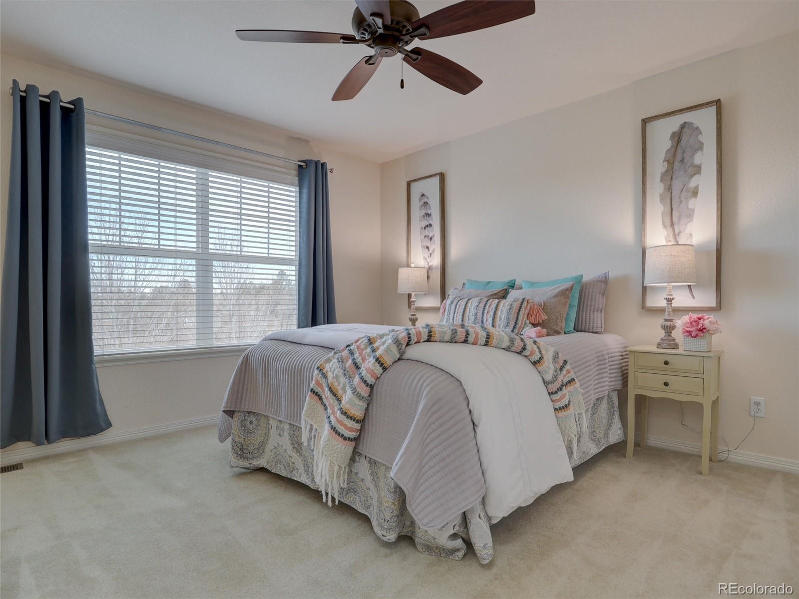 18288 East Caley Place Aurora, CO 80016 - Photo 21 of 50 a bedroom with a bed and a window