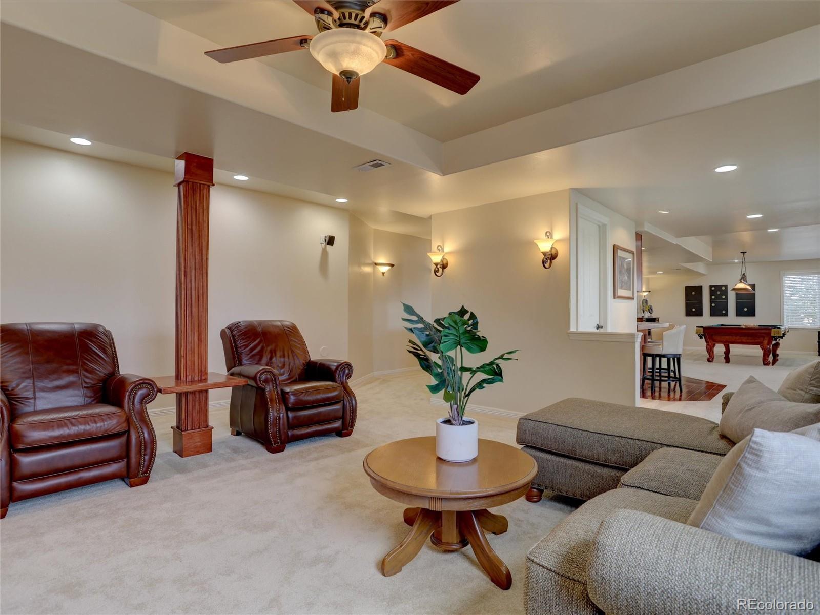 18288 East Caley Place Aurora, CO 80016 - Photo 32 of 50 a living room with furniture and a potted plant