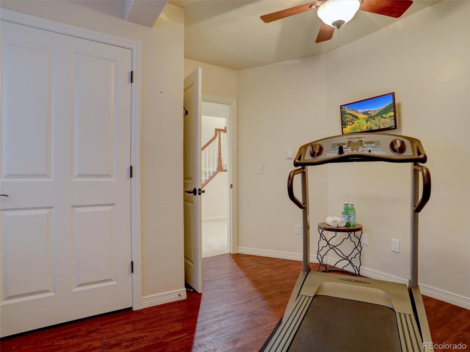 18288 East Caley Place Aurora, CO 80016 - Photo 34 of 50 a view of entryway with wooden floor