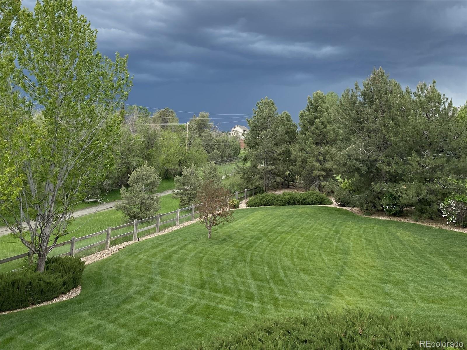 18288 East Caley Place Aurora, CO 80016 - Photo 40 of 50 a view of a field of grass and trees