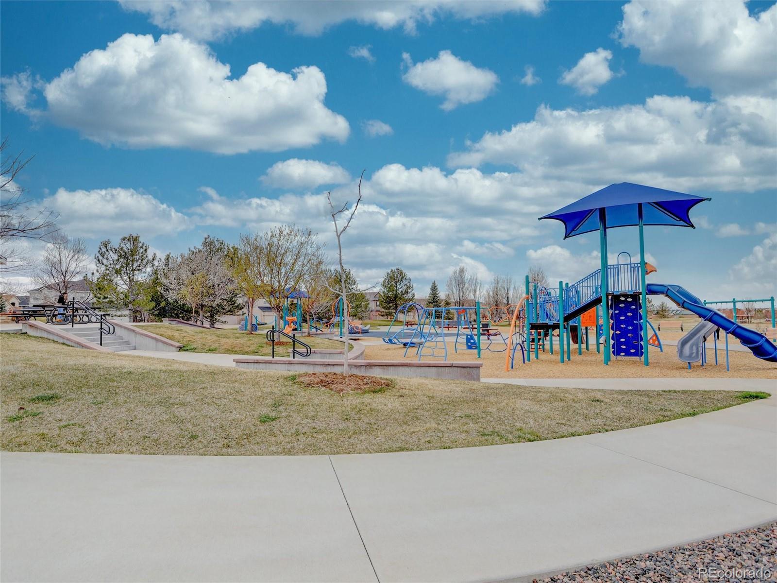 18288 East Caley Place Aurora, CO 80016 - Photo 48 of 50 a view of a water fountain and a yard