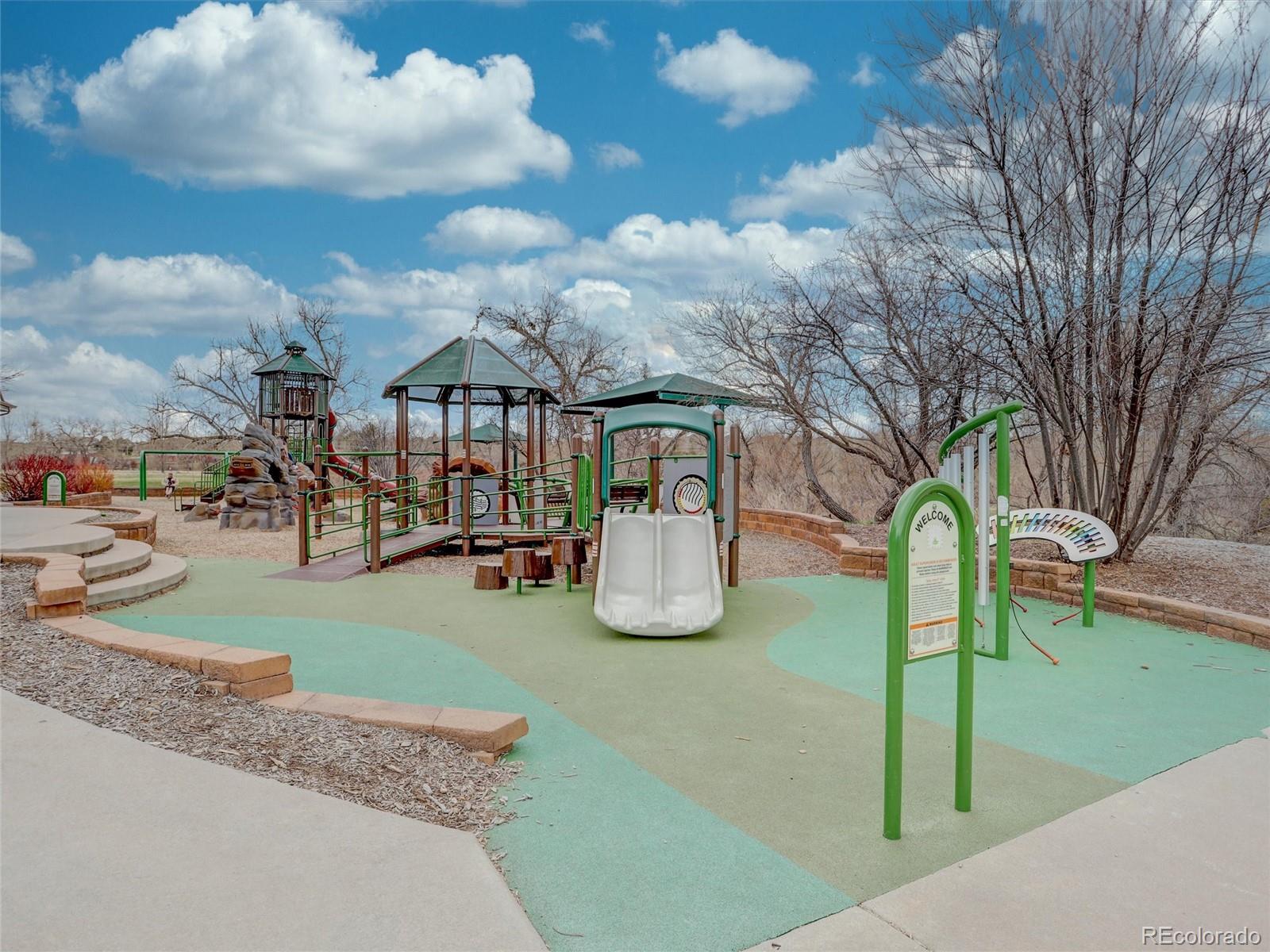 18288 East Caley Place Aurora, CO 80016 - Photo 49 of 50 a view of a park with swings and slides