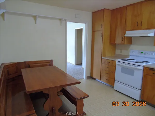 a room with water heater and a cabinet