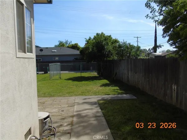 a view of a back yard of the house