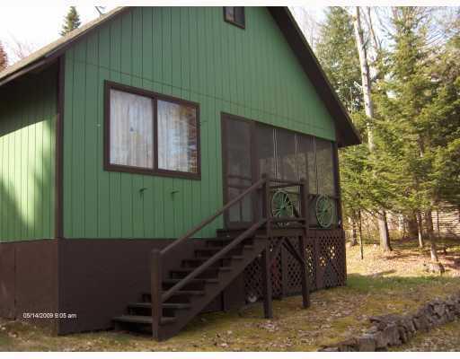 35 Hartland Road Rangeley, ME 04970 - Photo 4 of 8 Exterior Back. Screened porch facing...