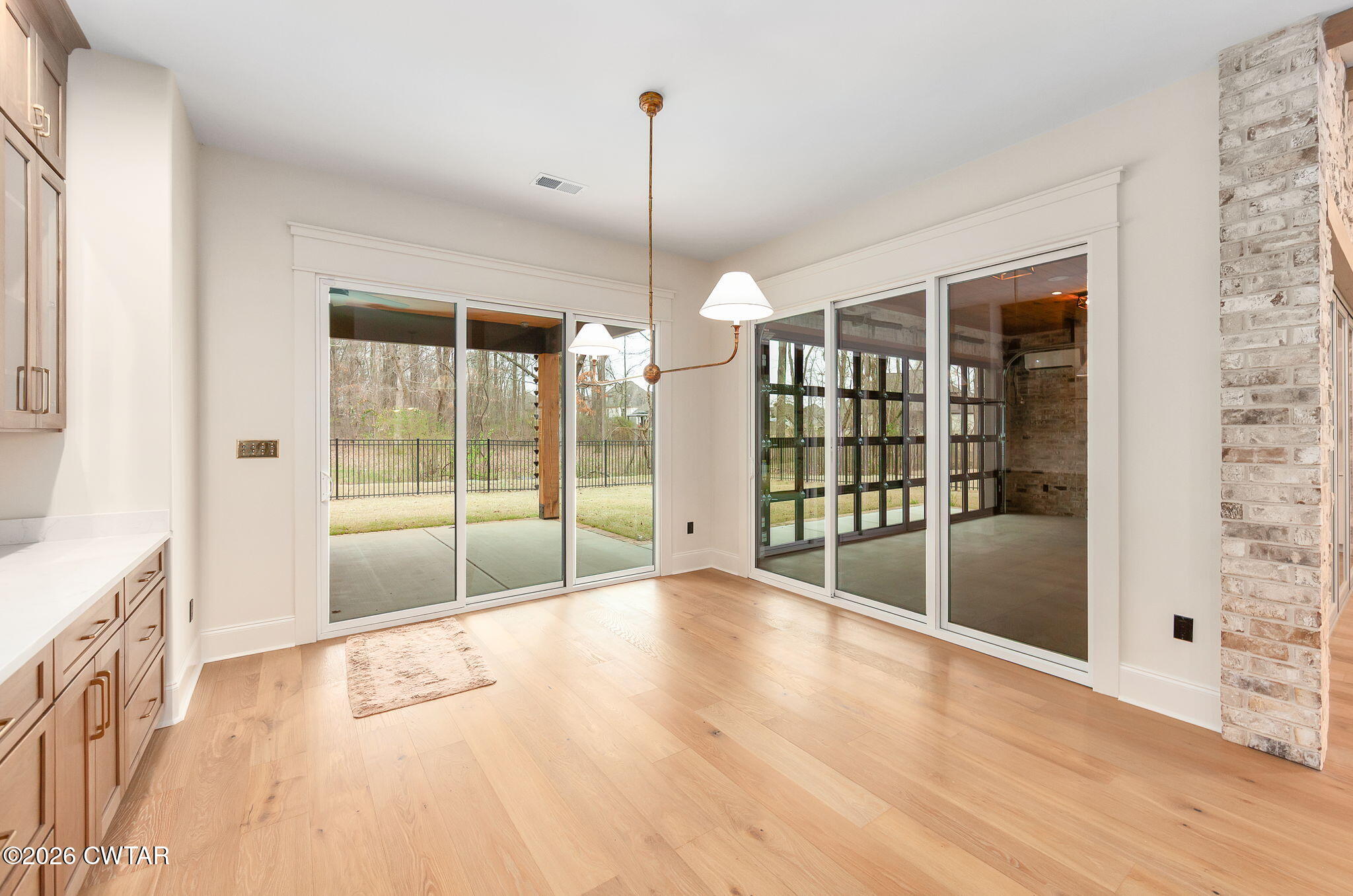 115 Buckingham Cove Jackson, TN 38305 - Photo 17 of 58 a view of an empty room with glass door and windows