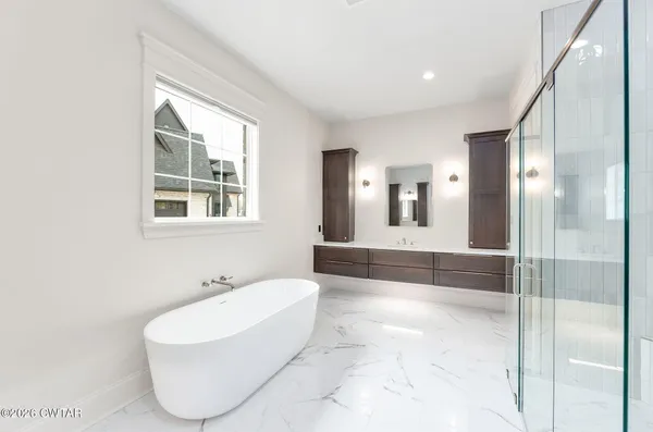 a white bath tub sitting in a bathroom