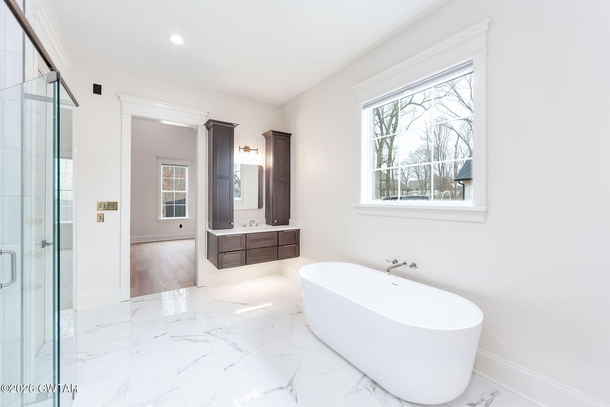 115 Buckingham Cove Jackson, TN 38305 - Photo 22 of 58 a spacious bathroom with a bathtub and shower