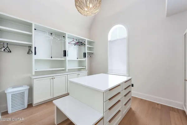 a bathroom with a sink vanity mirror and toilet