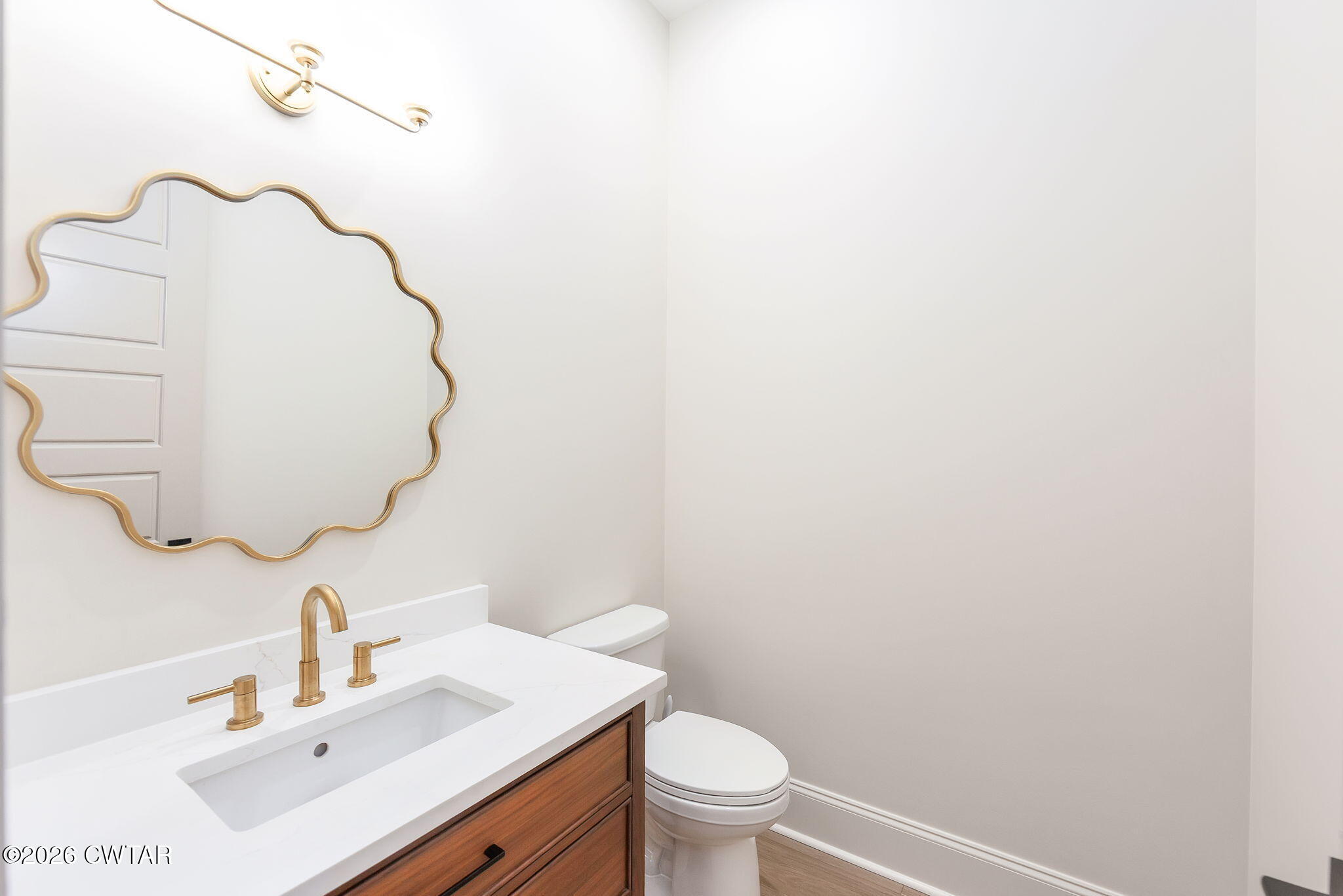 115 Buckingham Cove Jackson, TN 38305 - Photo 29 of 58 a bathroom with a sink vanity mirror and toilet