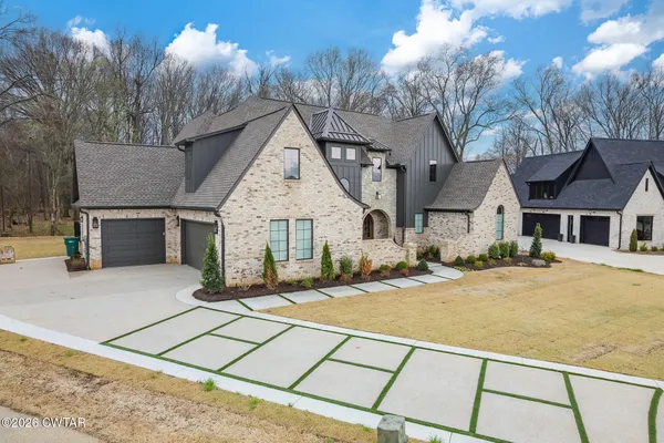 a view of a house with a snow on the road