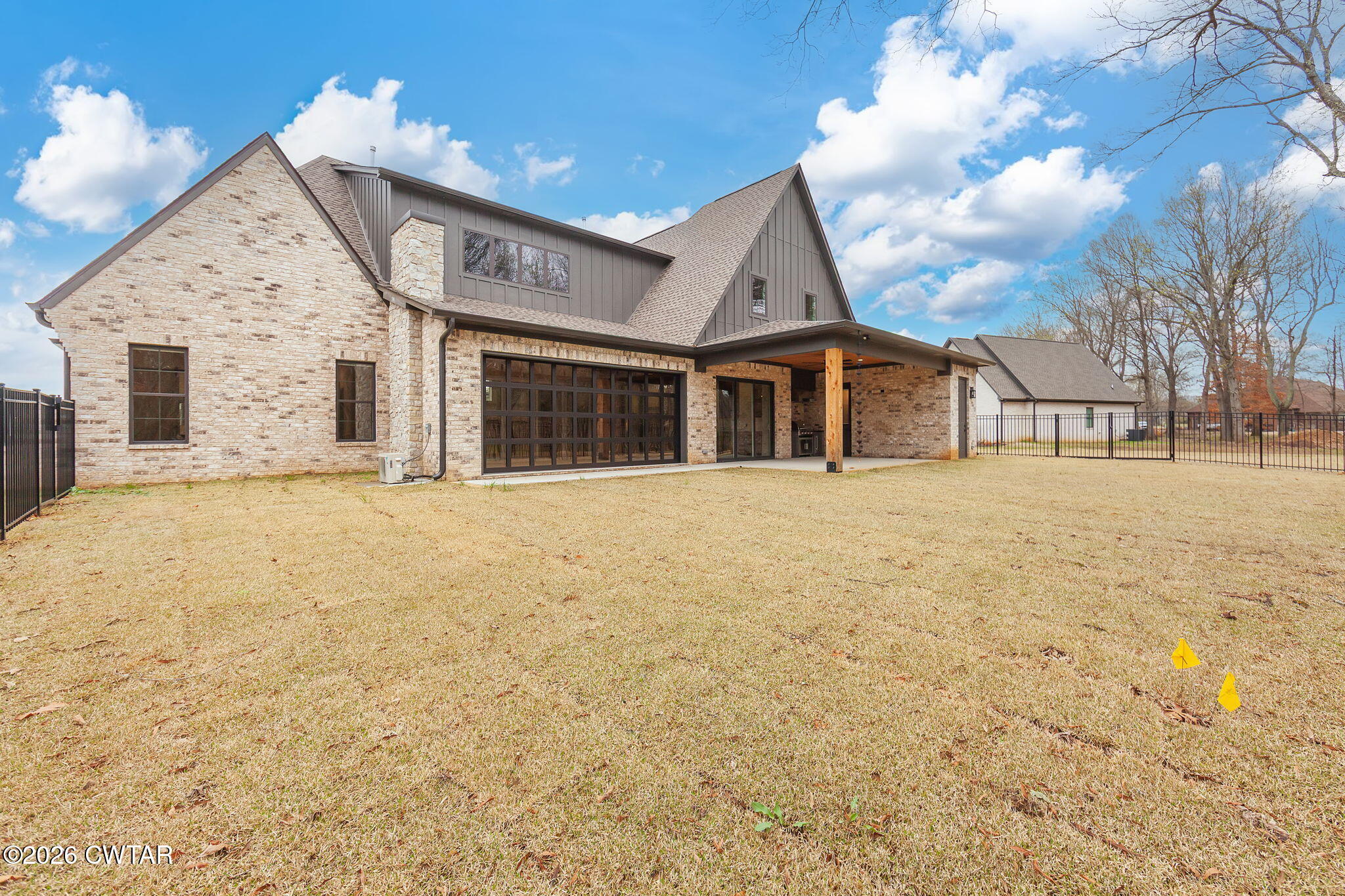 115 Buckingham Cove Jackson, TN 38305 - Photo 49 of 58 a view of a white house with a yard