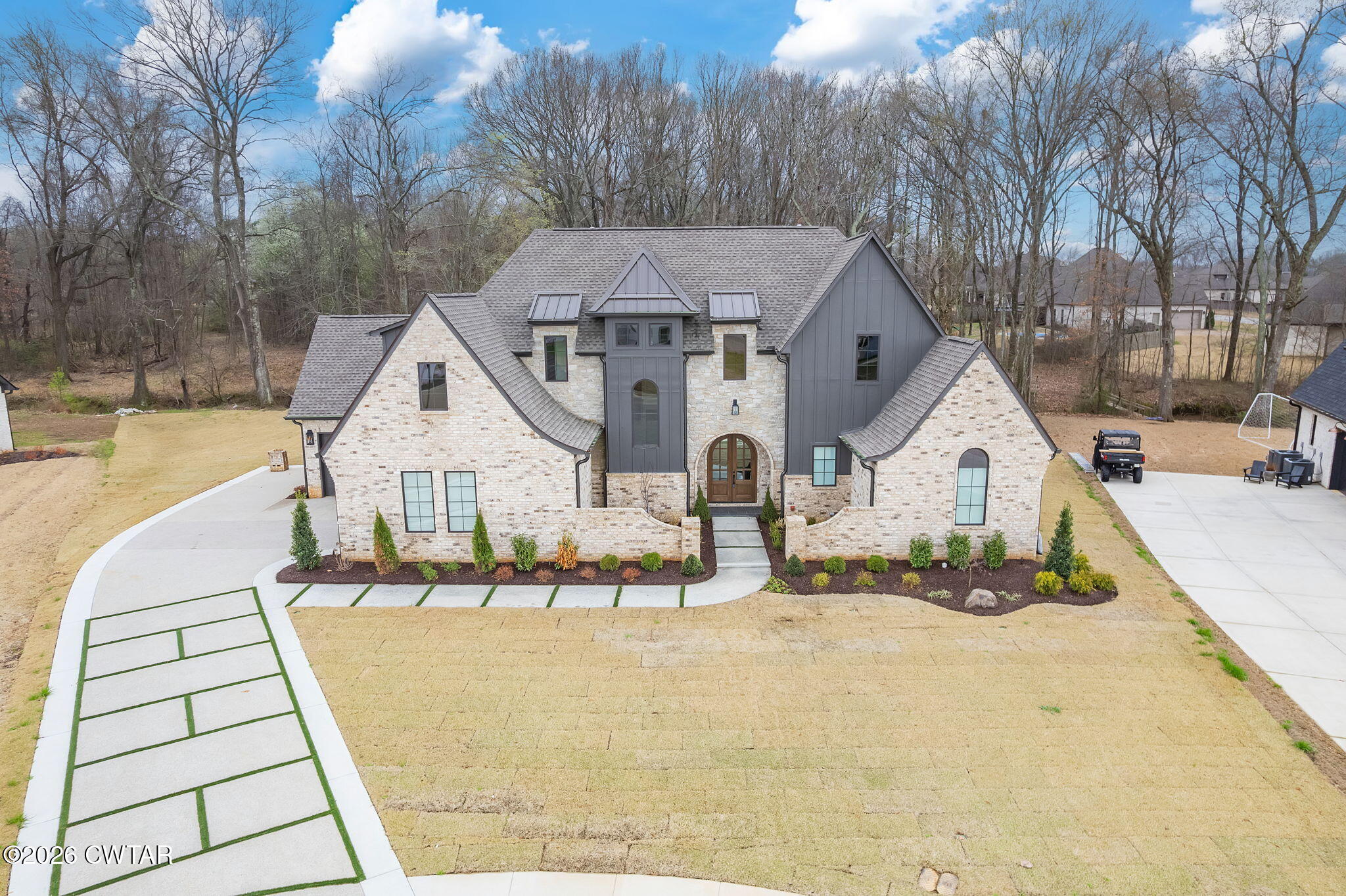 115 Buckingham Cove Jackson, TN 38305 - Photo 56 of 58 a view of a house with a yard