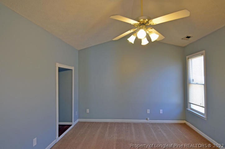 526 Riverwind Drive Spring Lake, NC 28390 - Photo 12 of 29 wooden floor in an empty room with a window