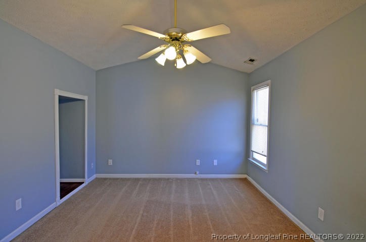 526 Riverwind Drive Spring Lake, NC 28390 - Photo 13 of 29 wooden floor in an empty room with a window