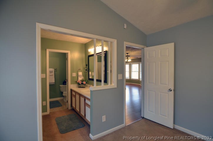 526 Riverwind Drive Spring Lake, NC 28390 - Photo 16 of 29 a view of a bathroom from a hallway