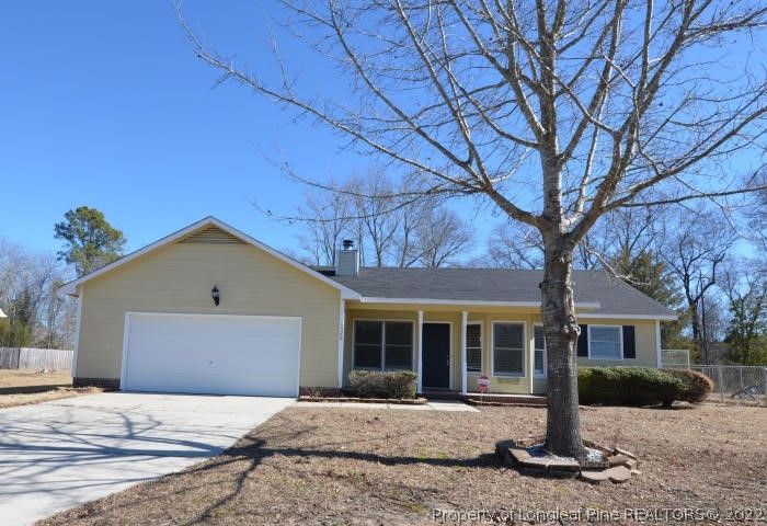 526 Riverwind Drive Spring Lake, NC 28390 - Photo 2 of 29 a front view of a house with a yard