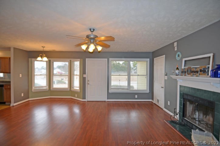 526 Riverwind Drive Spring Lake, NC 28390 - Photo 5 of 29 a view of an empty room with wooden floor and a window