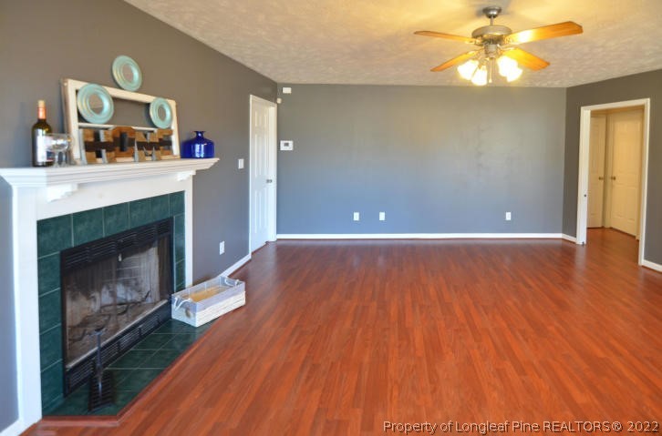 526 Riverwind Drive Spring Lake, NC 28390 - Photo 9 of 29 a view of a room with wooden floor and fireplace