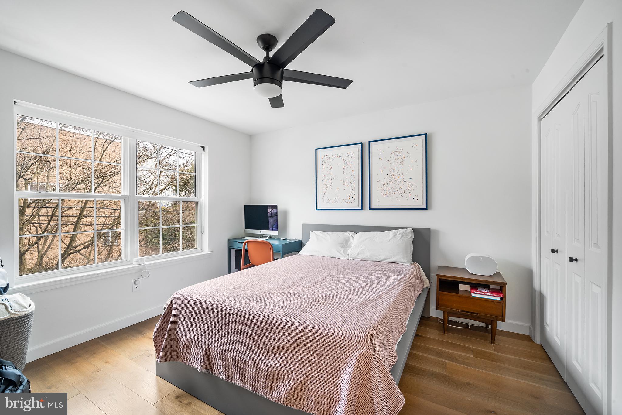243 Ripka Street Philadelphia, PA 19127 - Photo 13 of 31 a bedroom with a large bed and a large window