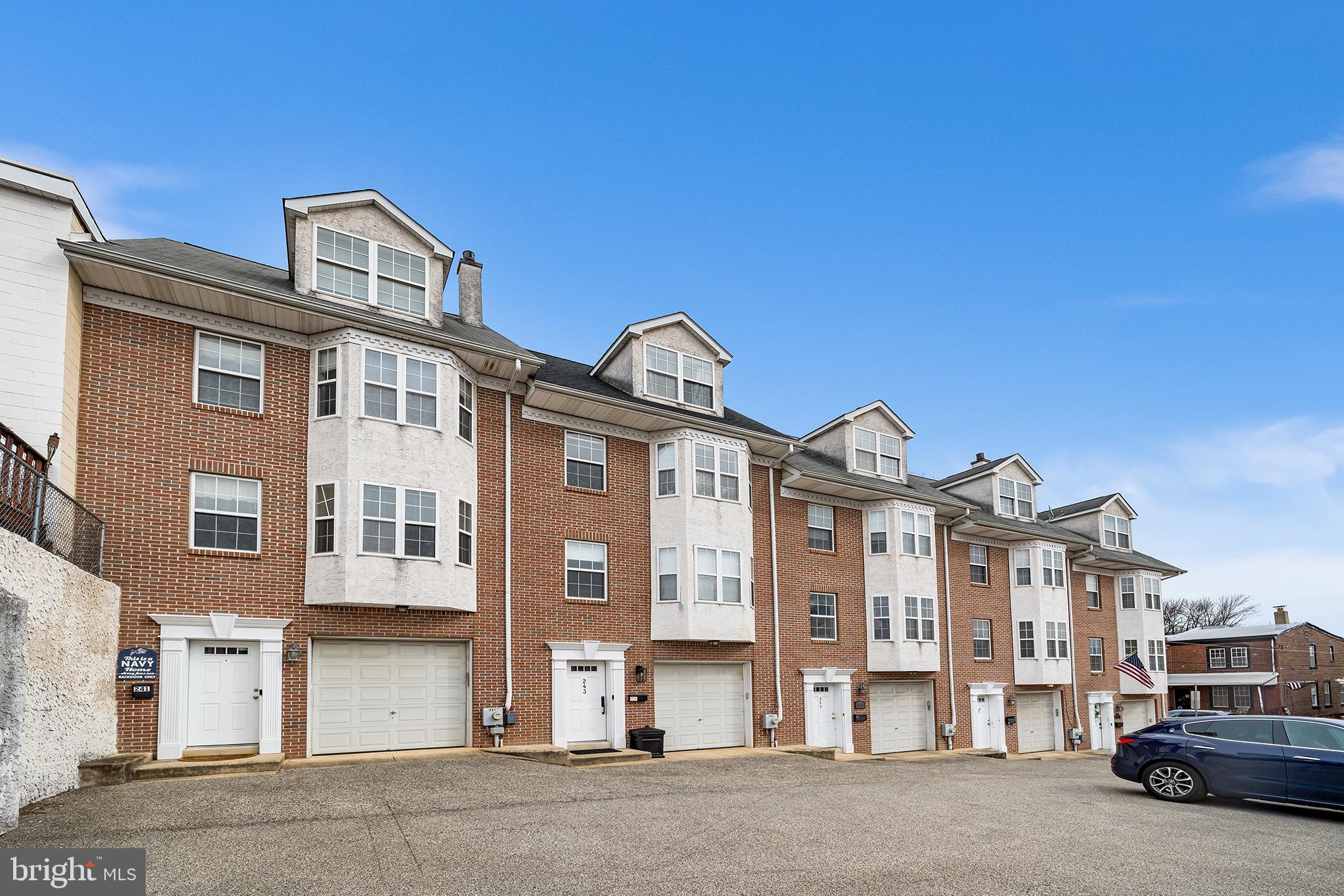 243 Ripka Street Philadelphia, PA 19127 - Photo 27 of 31 a front view of a residential apartment building with a yard