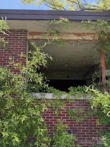 a brick building with a yard