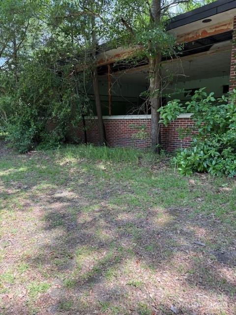 0 Windmill Avenue Dillon, SC 29536 - Photo 23 of 31 a view of backyard with plants and outdoor seating