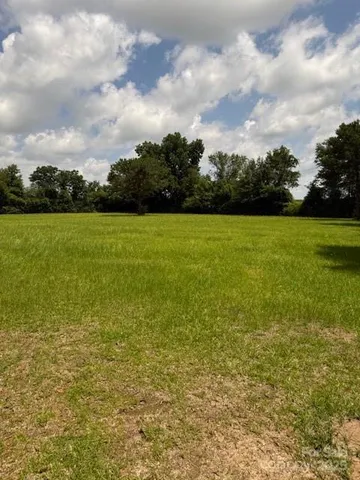 a view of a yard with an outdoor space
