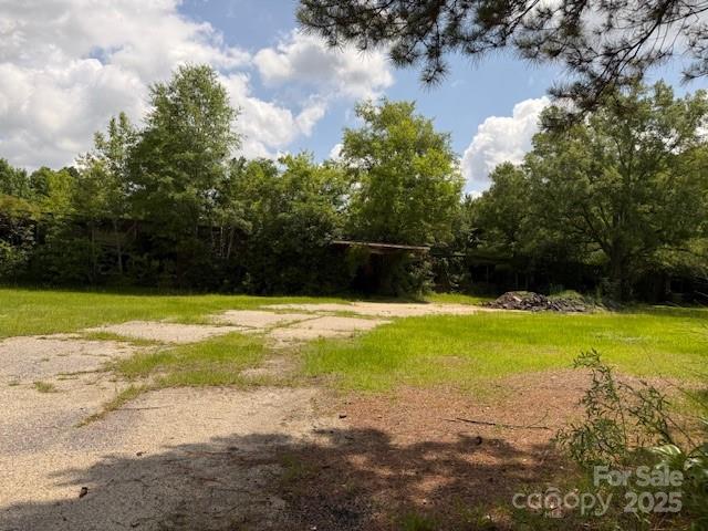 0 Windmill Avenue Dillon, SC 29536 - Photo 28 of 31 a view of a swimming pool with a yard
