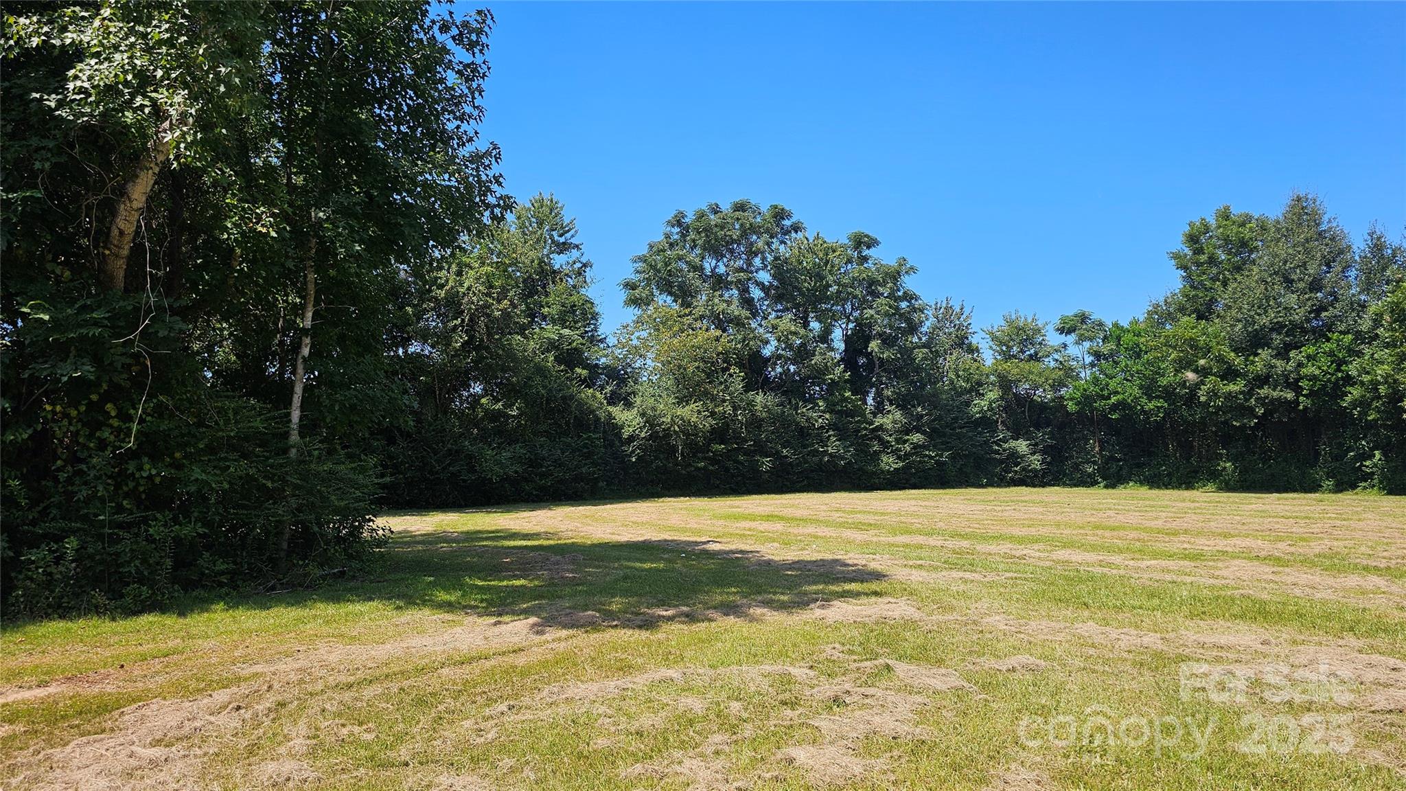 0 Windmill Avenue Dillon, SC 29536 - Photo 4 of 31 a view of swimming pool with an outdoor space and seating area