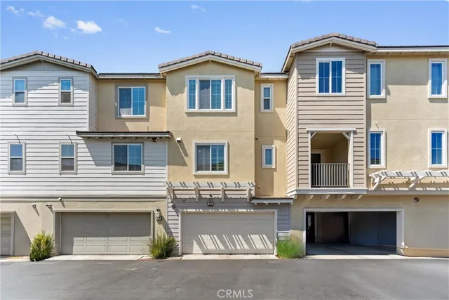 a front view of a house with a garage